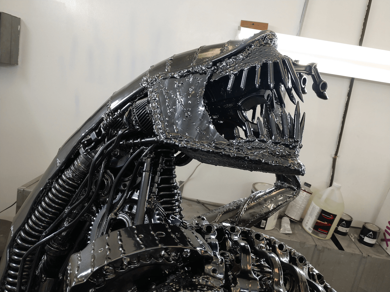 A statue of an alien with its mouth open