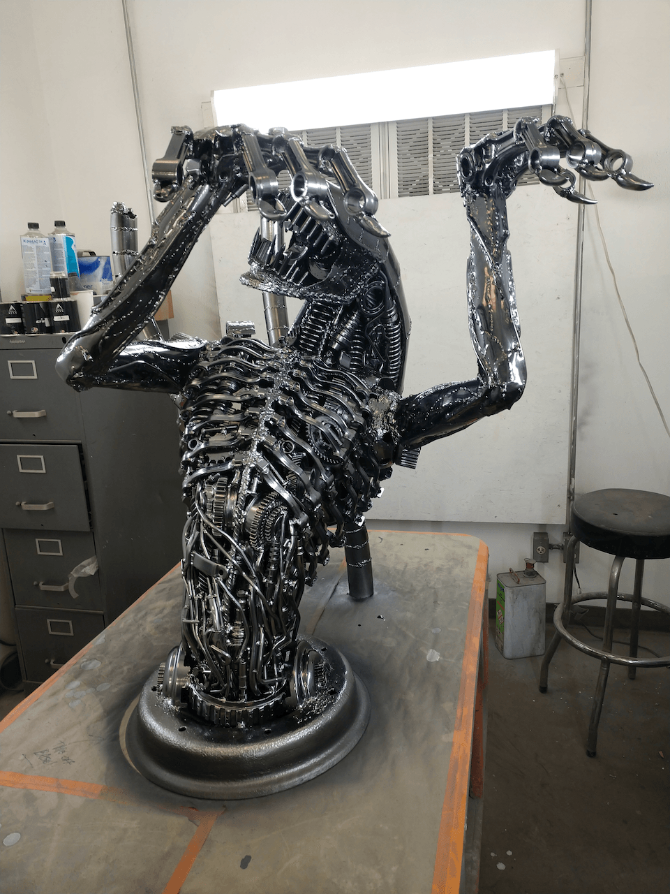 A statue of an alien is sitting on a table