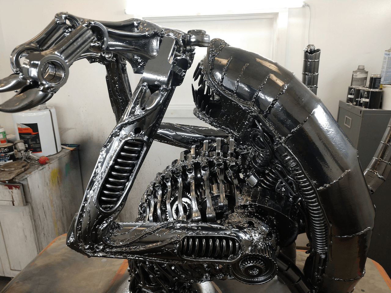 A statue of an alien is sitting on a table
