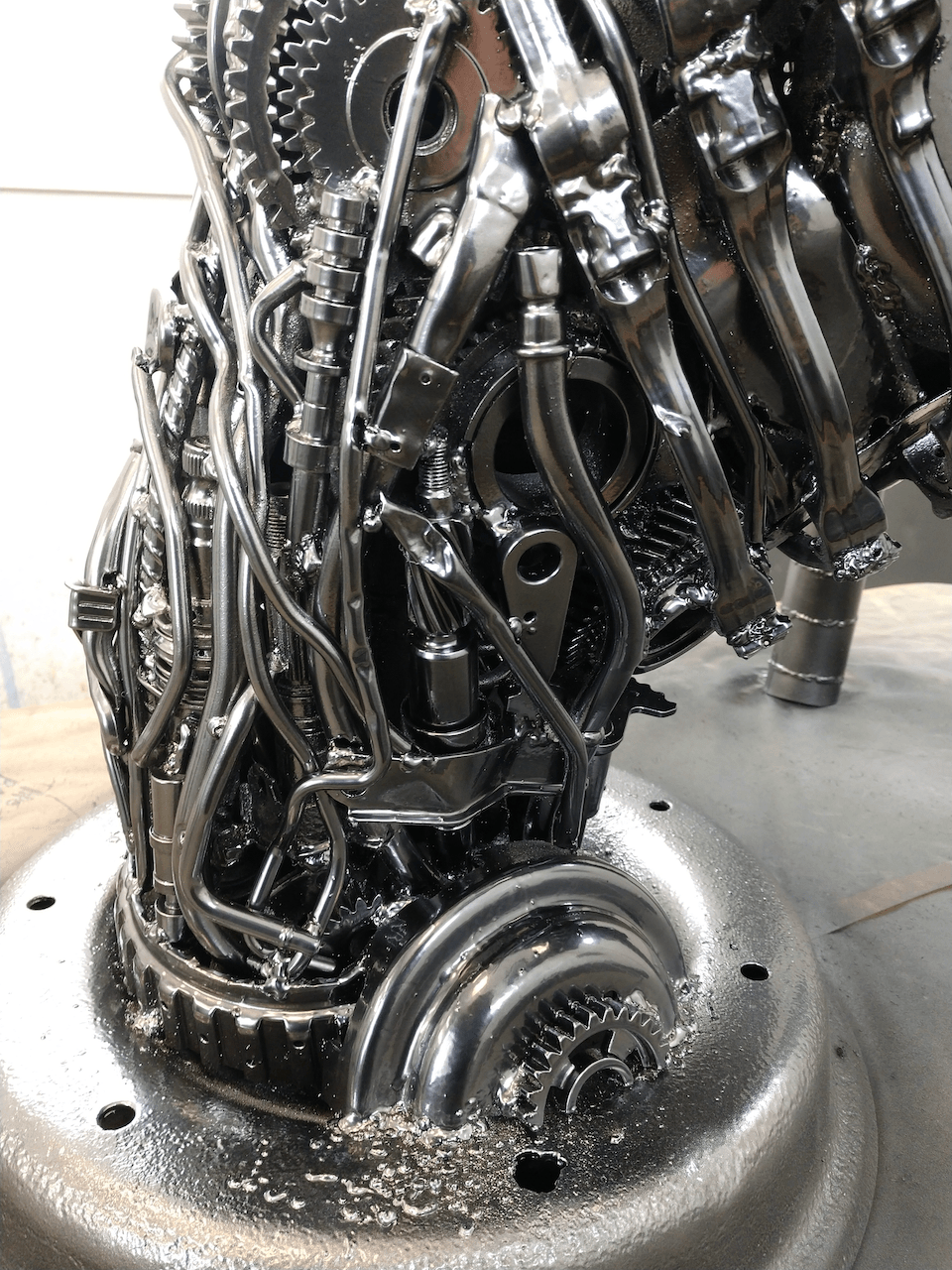 A close up of a metal sculpture on a table.