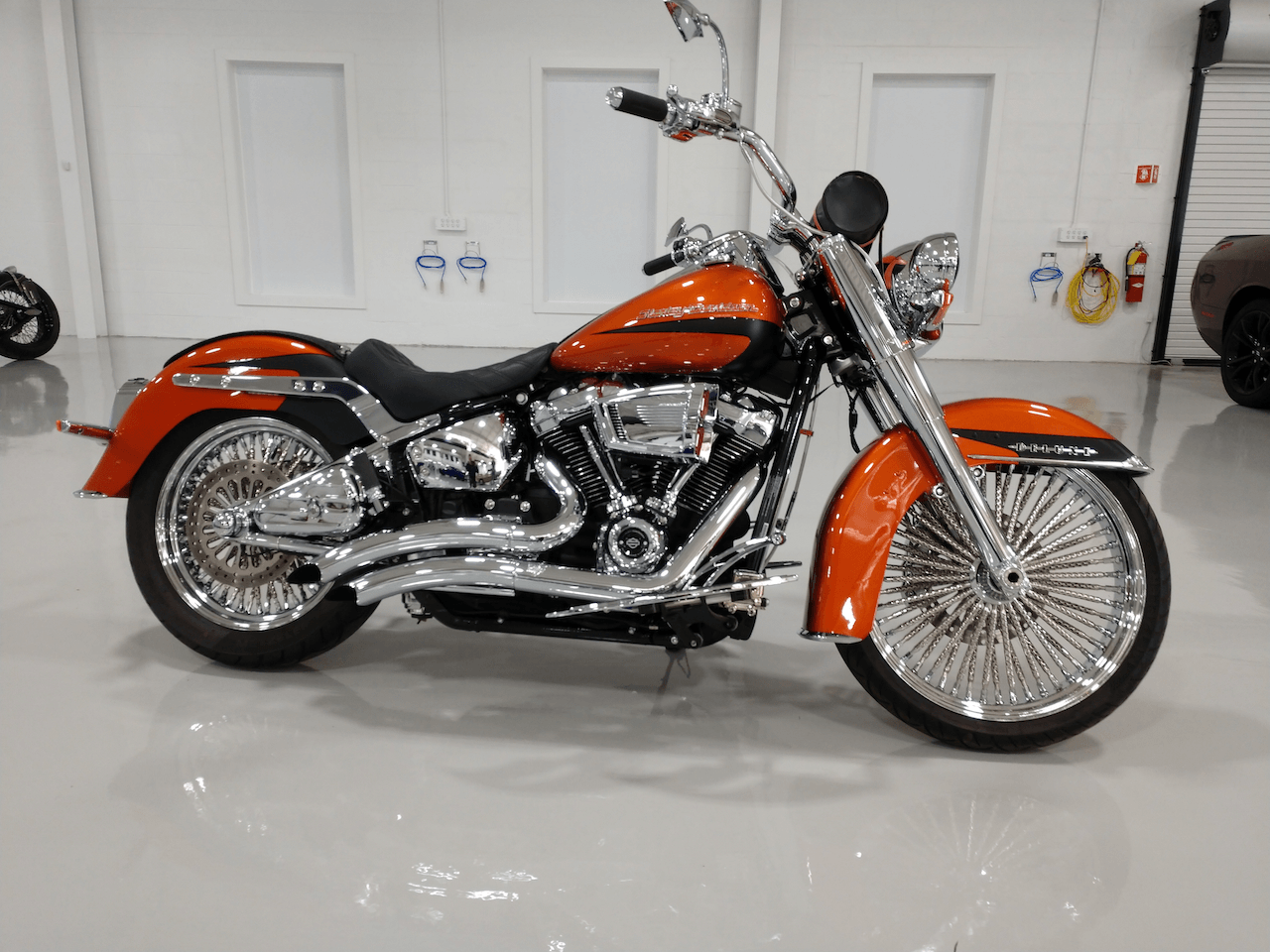 A harley davidson motorcycle is parked in a garage.