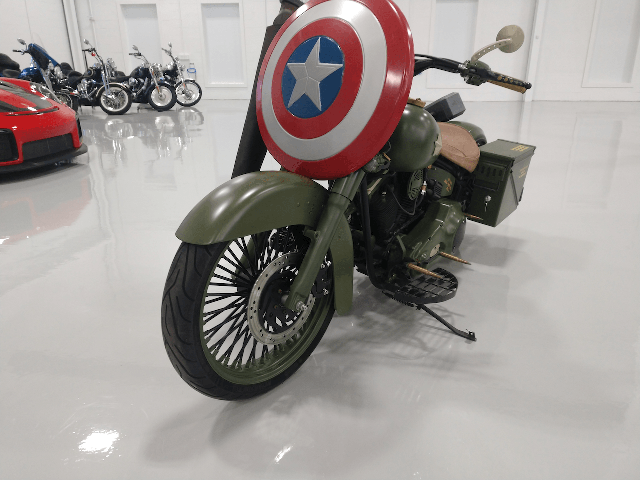 A motorcycle with a captain america shield on it