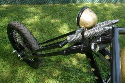 A close up of a motorcycle with a helmet on top of it.