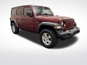 Red Jeep Wrangler SUV on a white background.