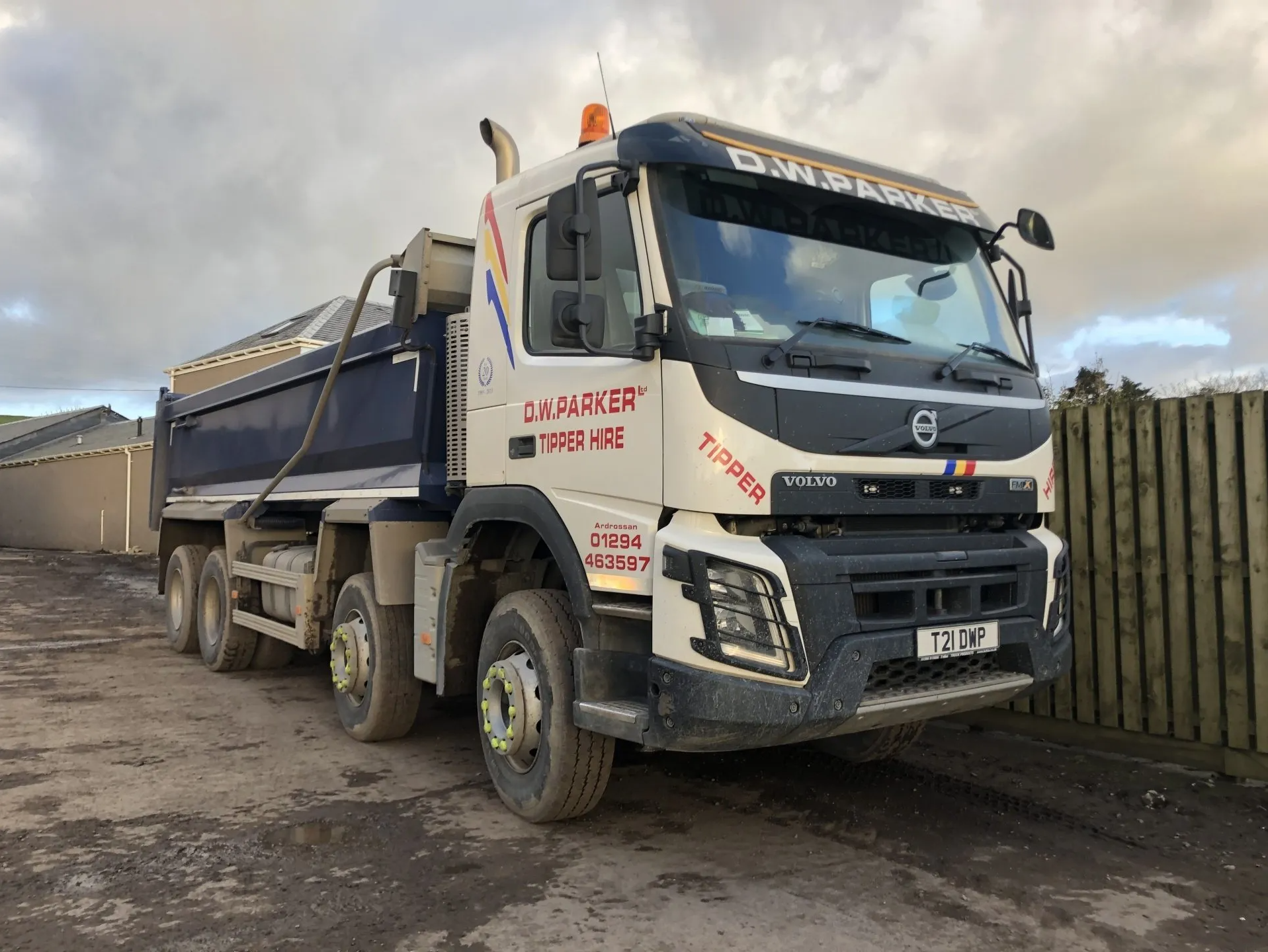 White lorry with blue trailer