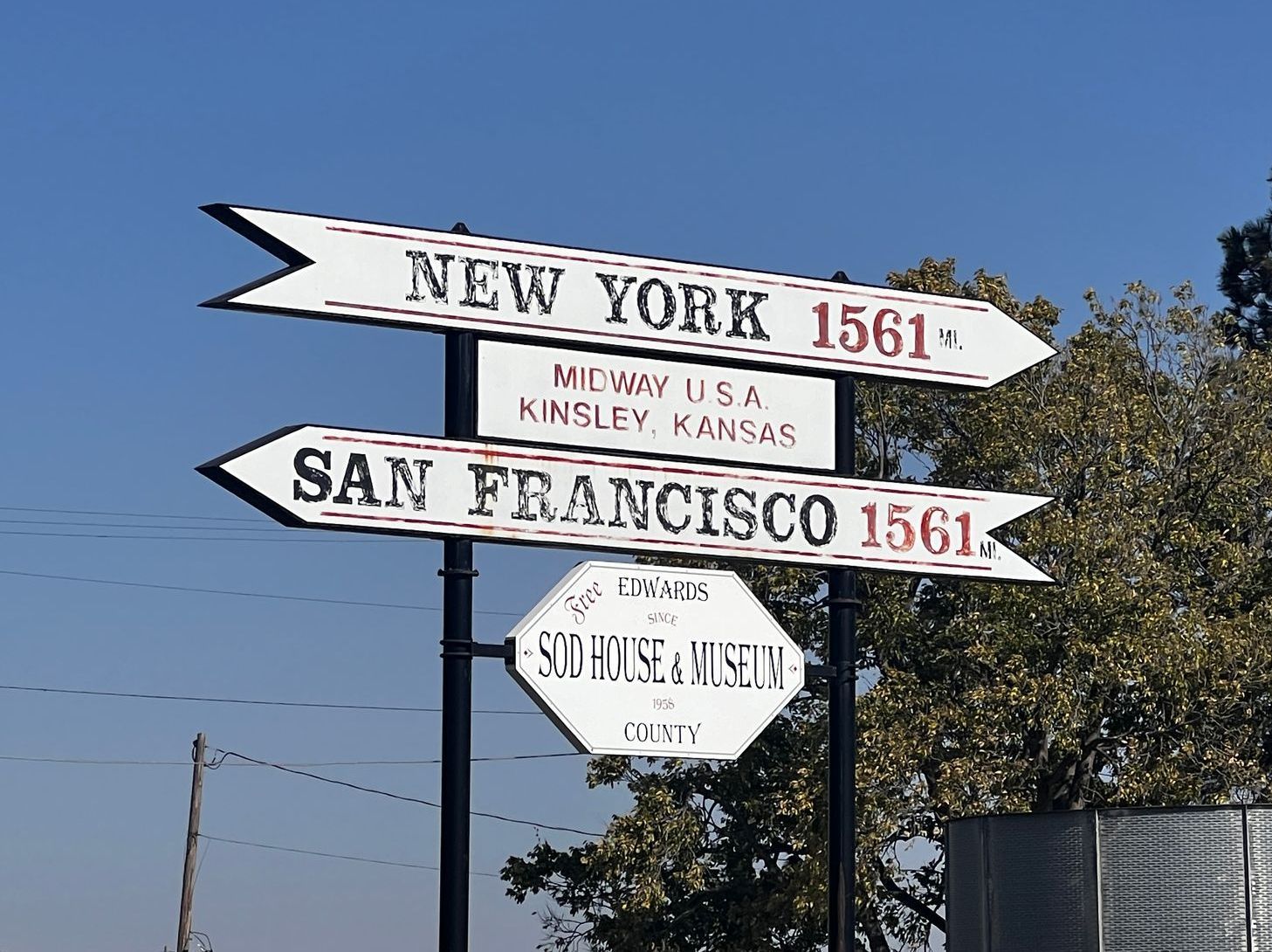 A sign pointing to new york and san francisco