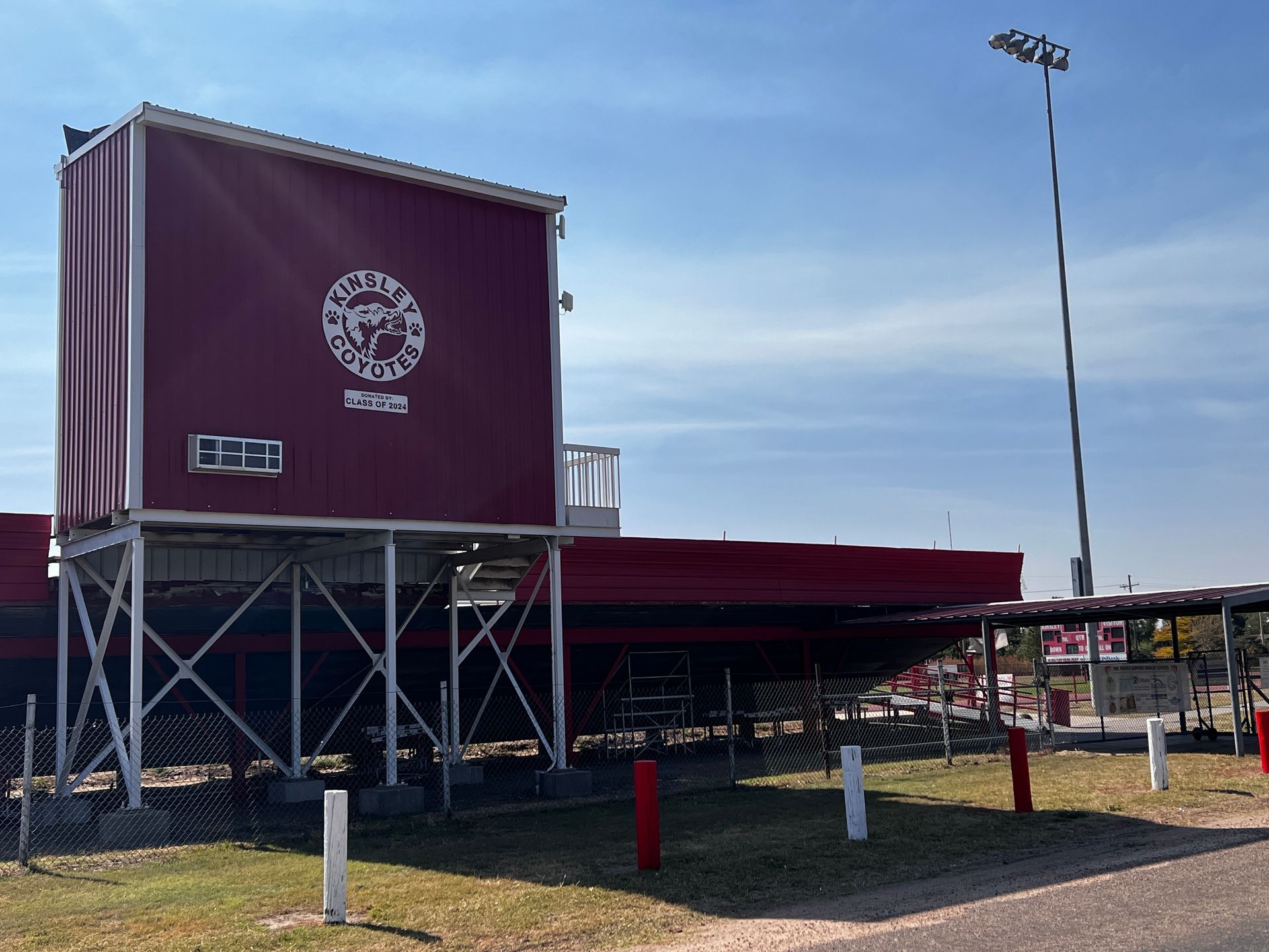 A large red building with the word kinsley coyotes on it.
