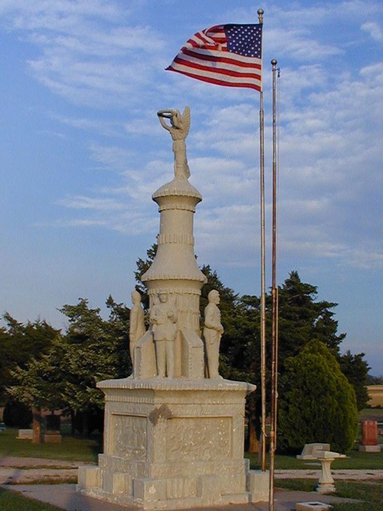 A statue with an american flag on top of it