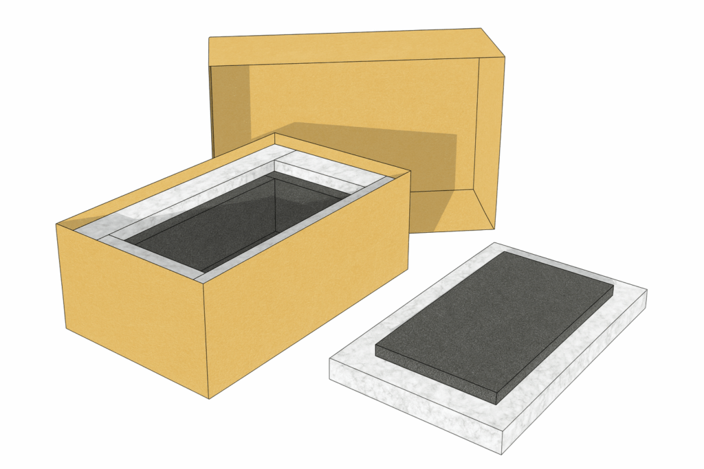 Open cardboard box with black foam insert beside a closed brown box and a white tray with foam insert