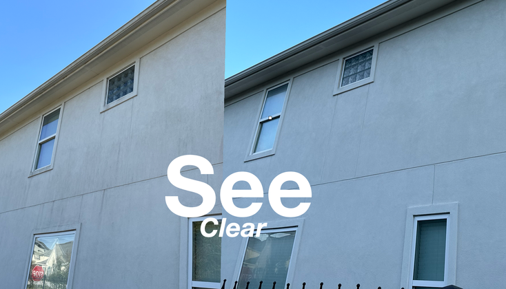 A row of windows reflects a vibrant orange sunset, with the text 