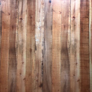 Vertical wooden planks with weathered brown and tan tones