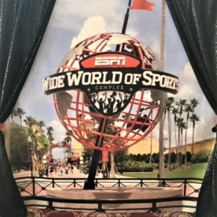 ESPN Wide World of Sports globe entrance with palm trees and walkway banners