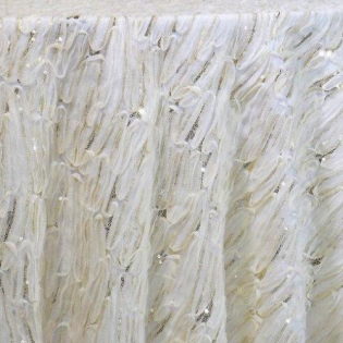 Close-up of thick white textured bristles or fibers, densely packed in vertical strands