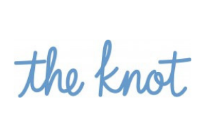 Blue handwritten logo reading “the knot” on a white background