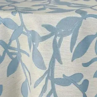 Light blue leafy vine pattern on a white fabric background
