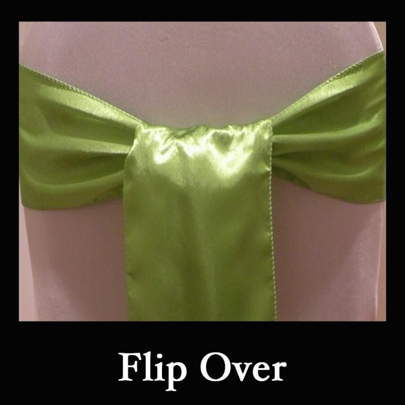 Satin green ribbon tied in a bow with the words “Flip Over” below