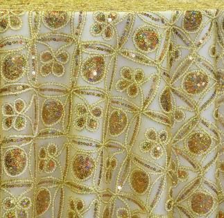 Gold embroidered fabric with a repeating floral and geometric pattern