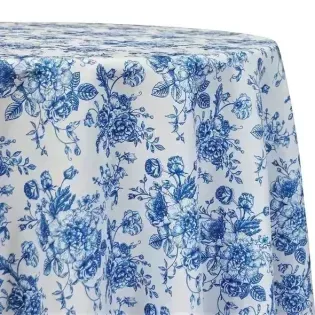 Blue floral patterned tablecloth draped over a round table