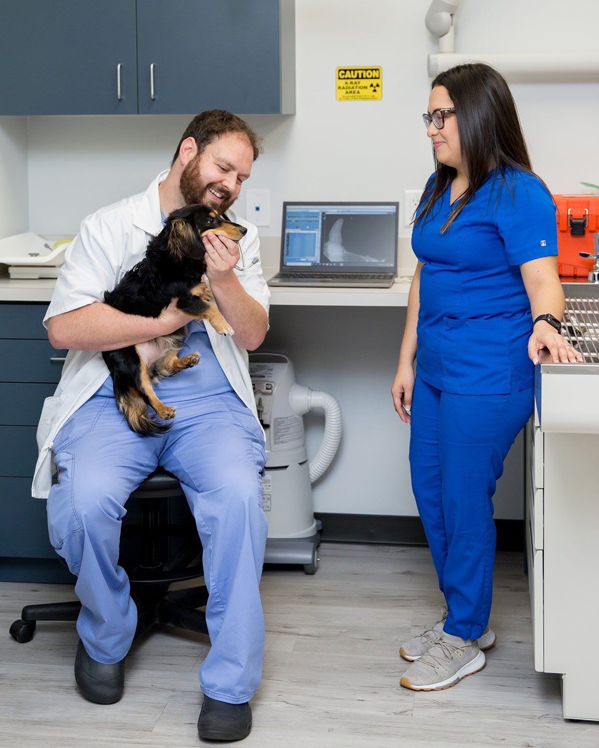 A Couple of Vets - technicians with a dog