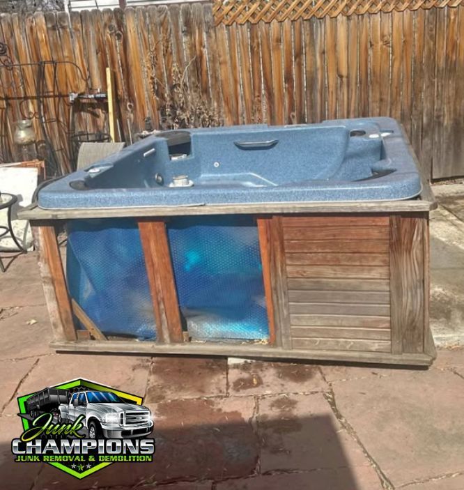 Old hot tub about to be removed in Rancho Cucamonga backyard by Junk Champions Junk Removal 