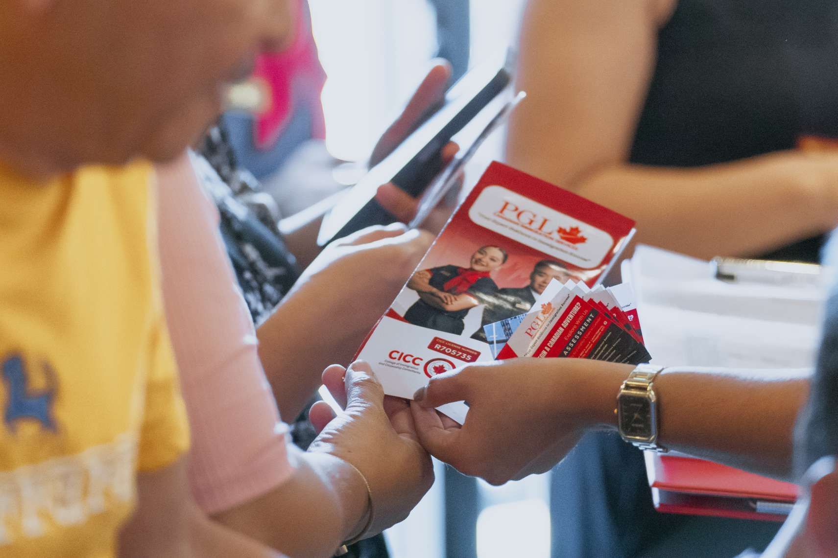 A person is holding a pamphlet that says evil on it