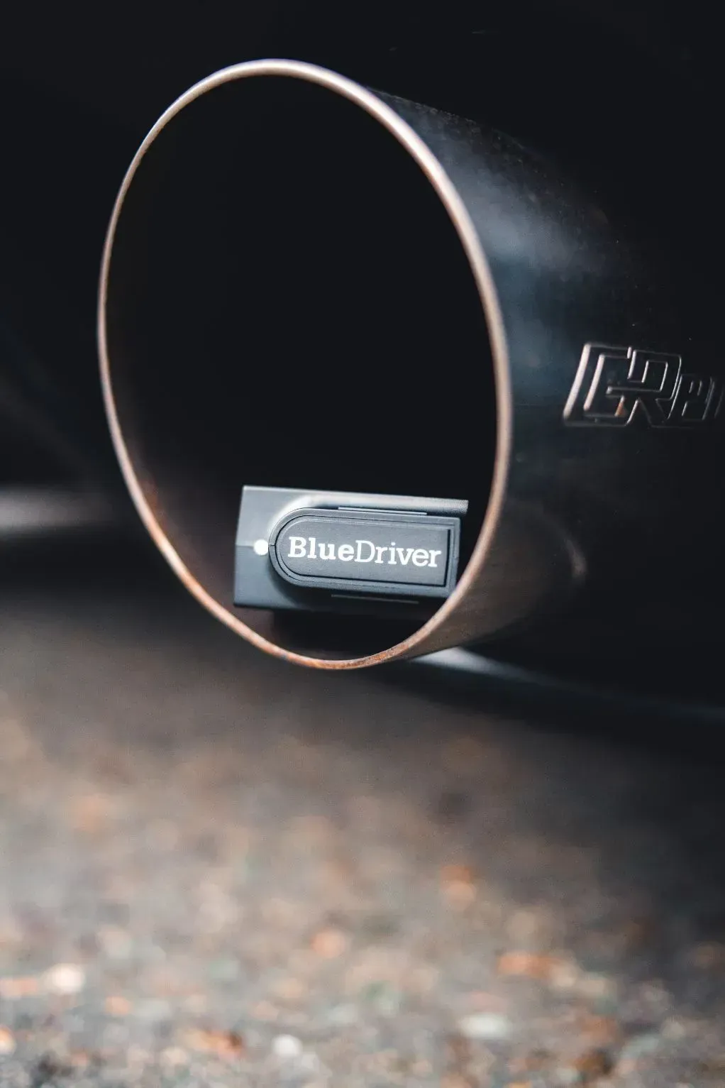 Close-up of a Black Car Exhaust Pipe — Chester's Mechanical & Performance in Tamworth, NSW