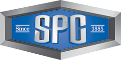 Logo for SPC. Silver letters over blue in a silver framed hexagon, “Since” on left and “1885” on the right.