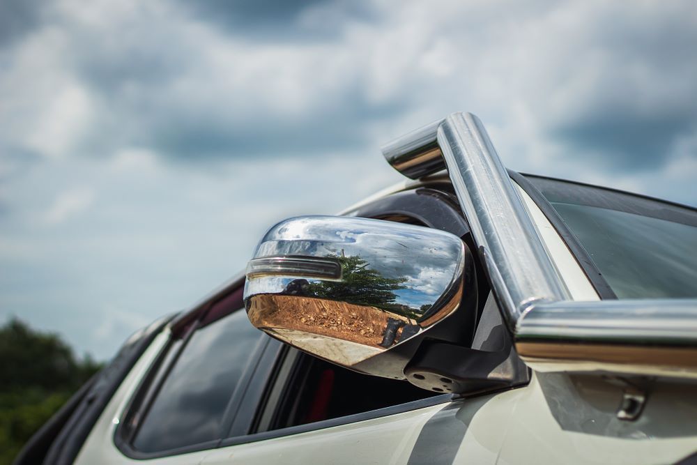 A Close Up of a Side View Mirror on a Car — About Town Windscreen Repairs & Replacements in Wulguru, QLD