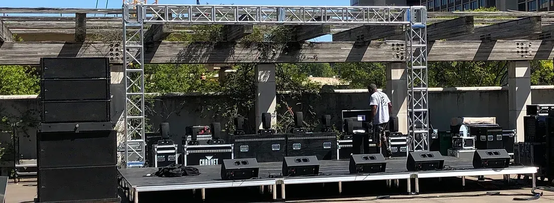 A large stage is being set up for a concert.