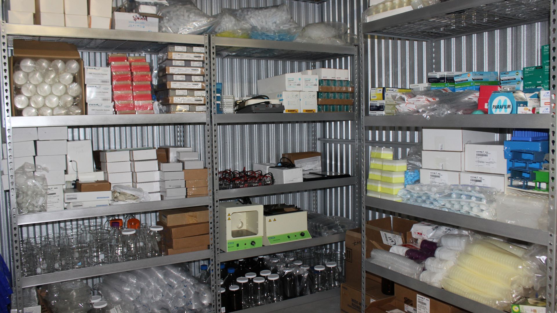 Science and Laboratory supplies on shelves in a storage facility