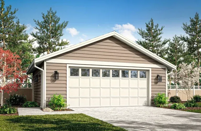 Single-story beige house with a white garage door, driveway, and landscaped front yard under a blue sky