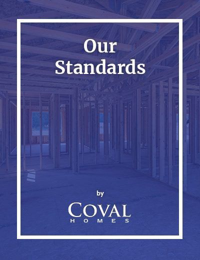 Coval Homes “Our Standards” title on a blue-tinted building background