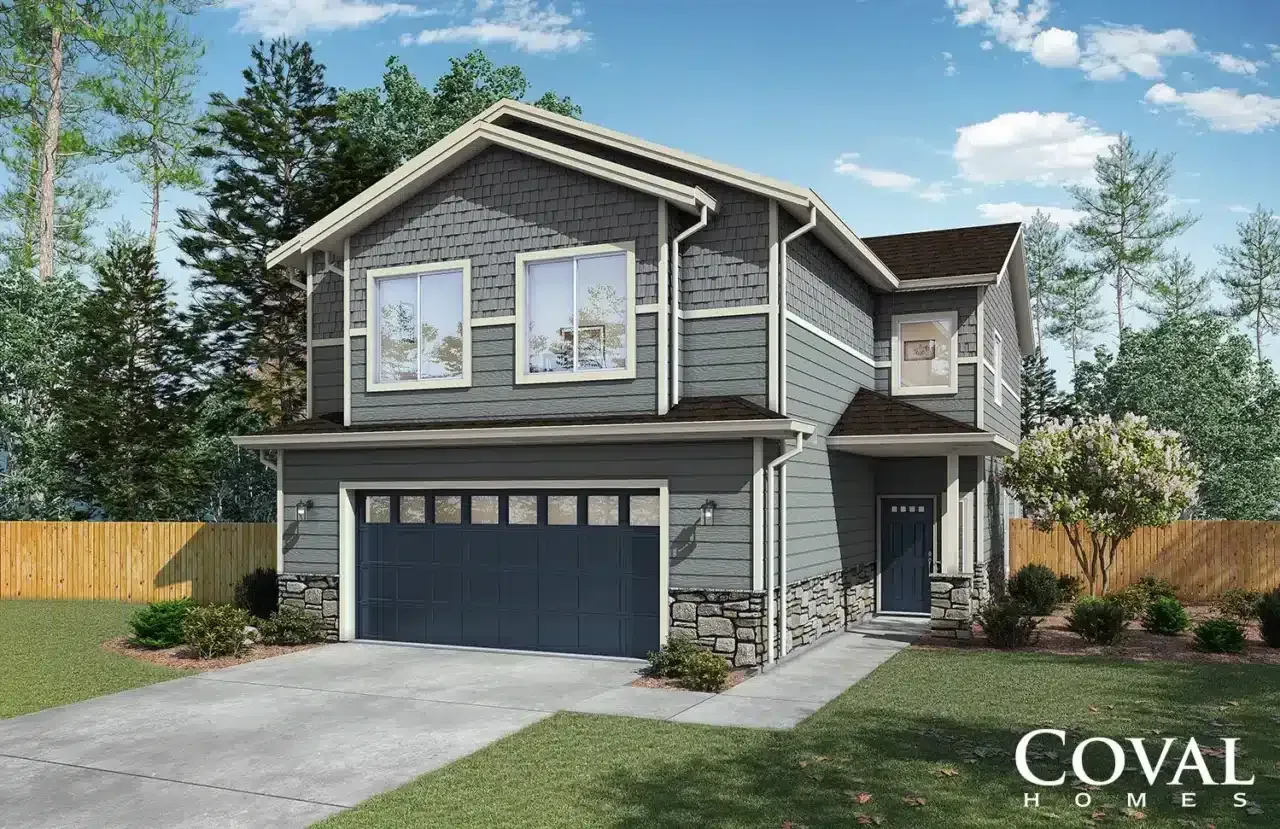 Modern two-story gray house with dark garage, white trim, and a front porch on a wooded lot
