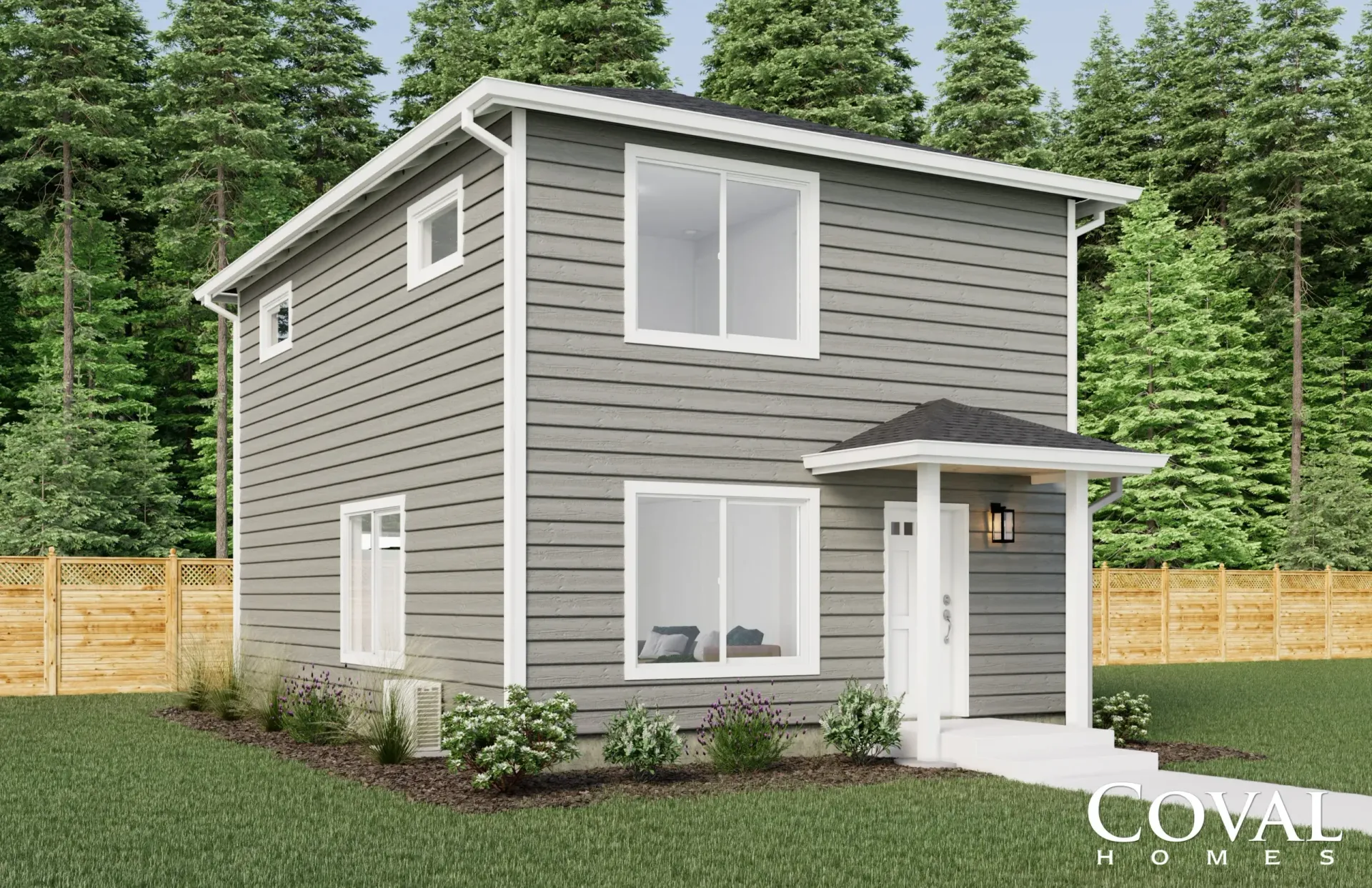 Two-story gray house with white trim, front porch, and surrounding fence in a wooded yard