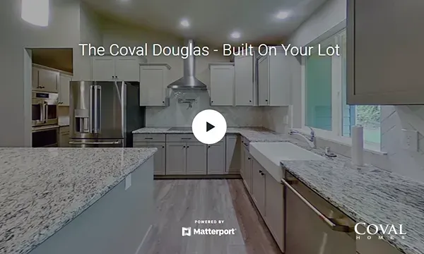 Spacious modern kitchen with granite countertops, white cabinets, and stainless steel appliances