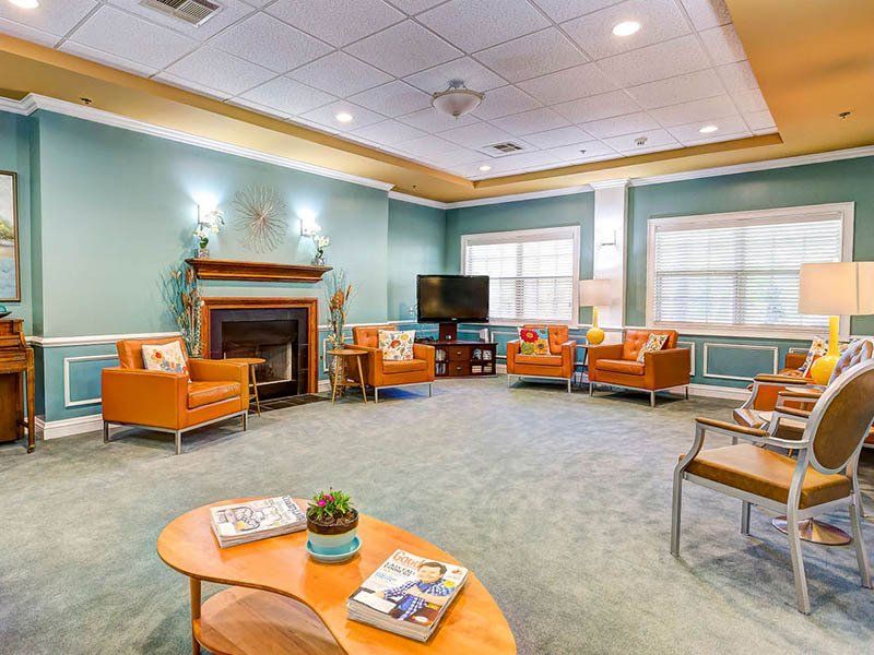A living room filled with furniture and a fireplace.