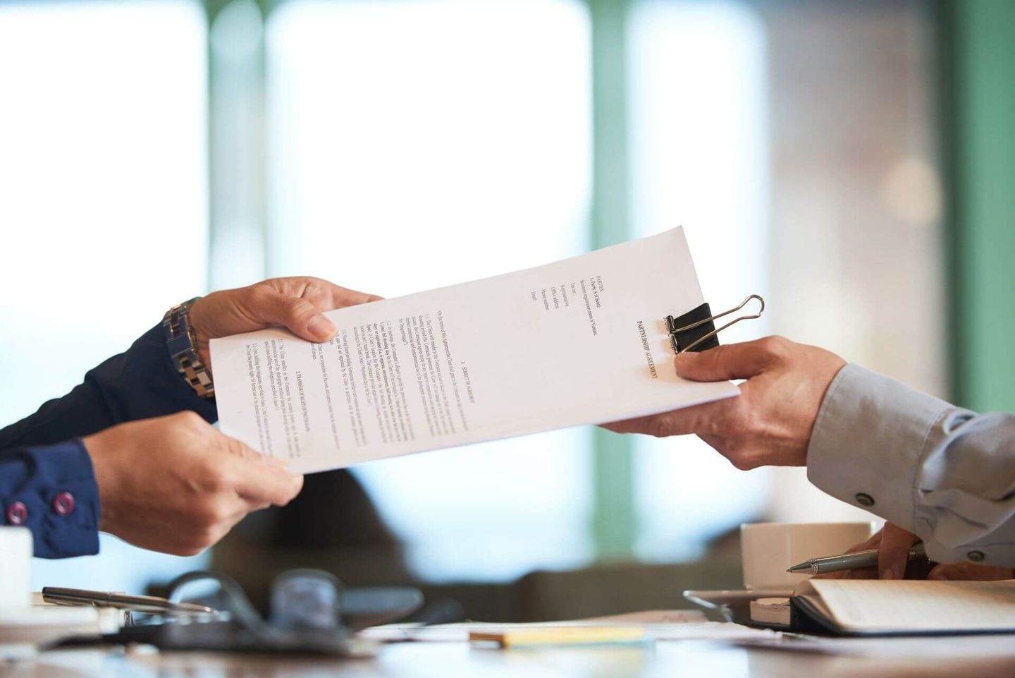 Attorney passing the contract file to the client