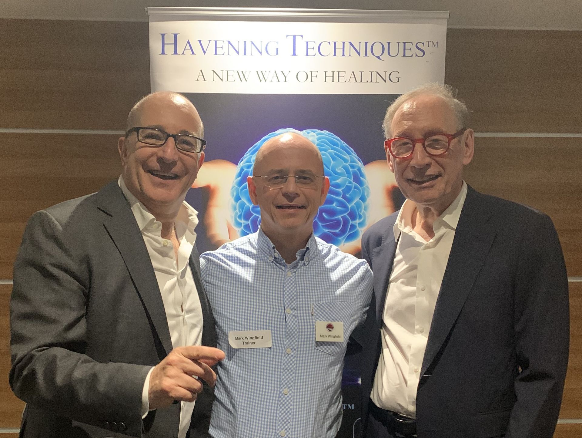 Picture of Paul McKenna Mark Wingfield and Dr Ron Ruden in front of a Havening Techniques banner at the London Practice Group Nov 2023