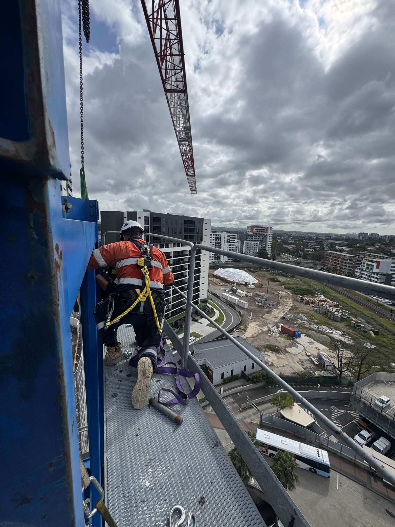 Tower crane rising above a high-rise construction site in NSW