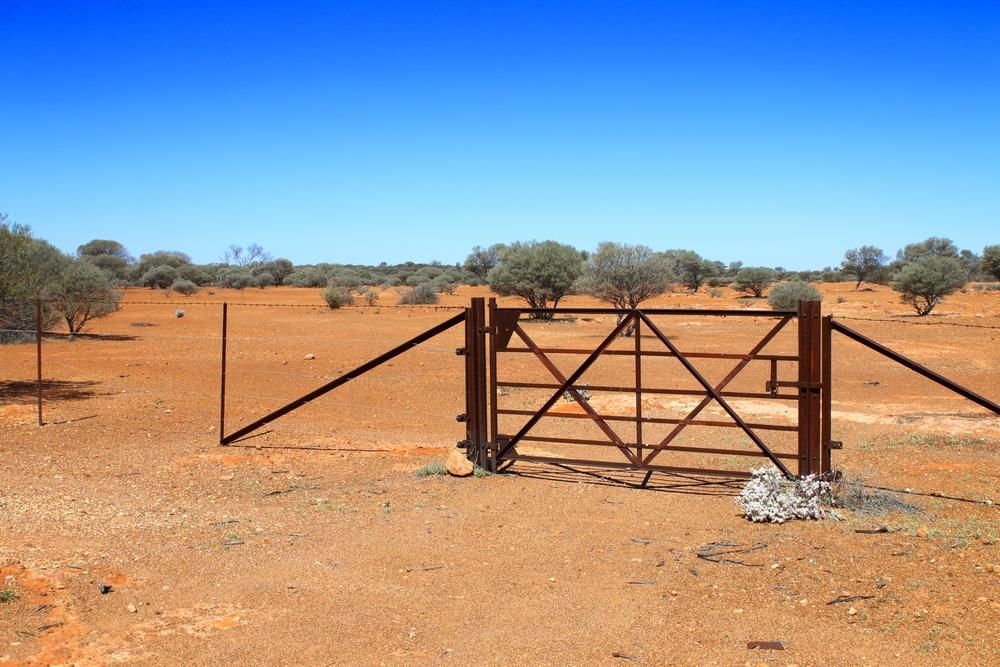 a Rusty Gate in the Middle of a Desert — Tony Sinclair Fencing In Bellingen, NSW 
