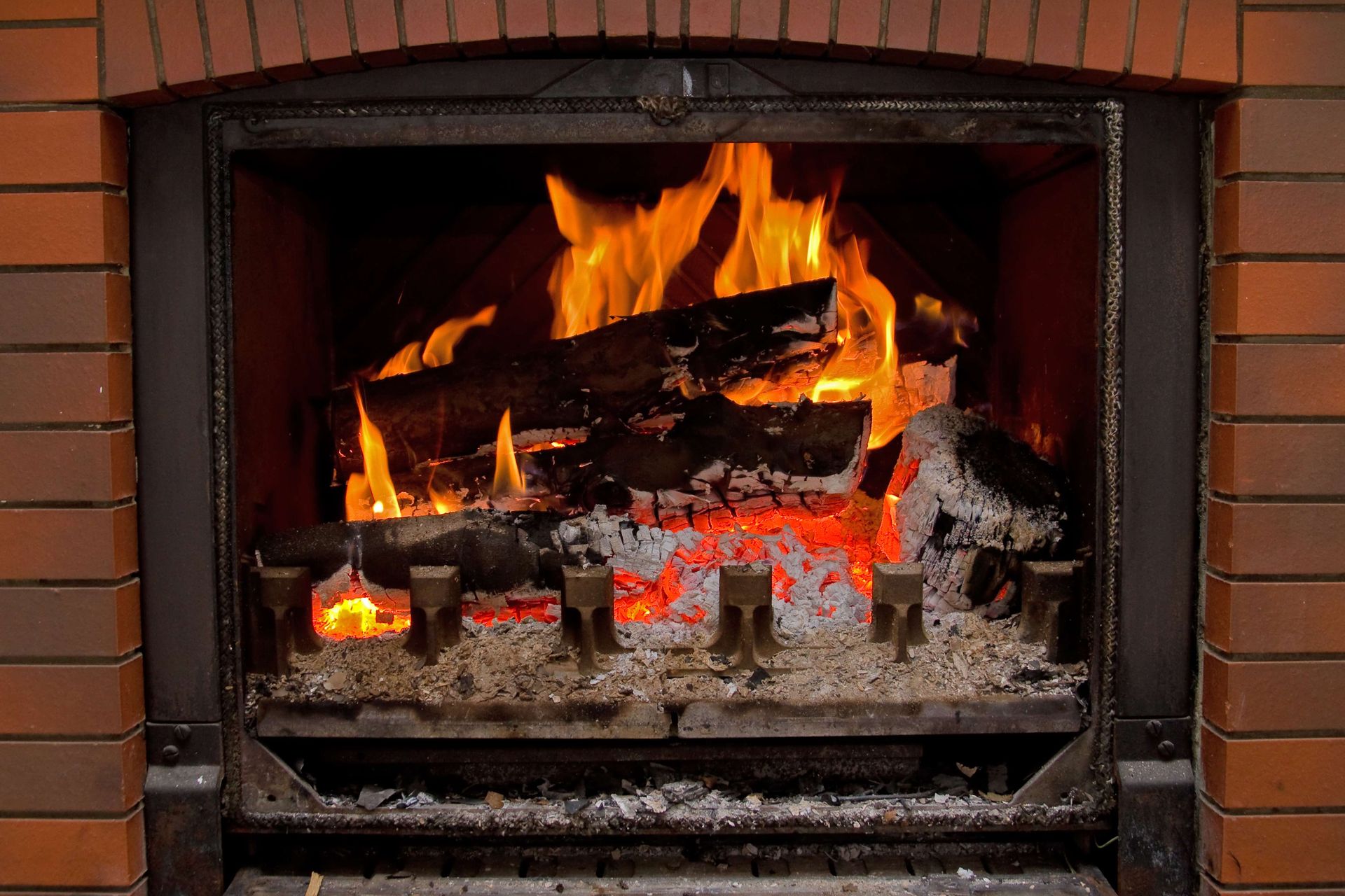 A warm fire crackles in a brick fireplace at Leonard's Stone and Fireplace, Burleson, TX. Visit for fireplace parts in Crowley, TX. A warm fire crackles in a brick fireplace at Leonard's Stone and Fireplace, Burleson, TX. Visit for fireplace parts in Crowley, TX.