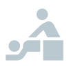 An icon depicting a person giving a back massage to another person lying on a table.