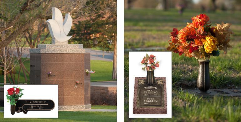 Floral arrangements placed at a memorial monument in a cemetery.