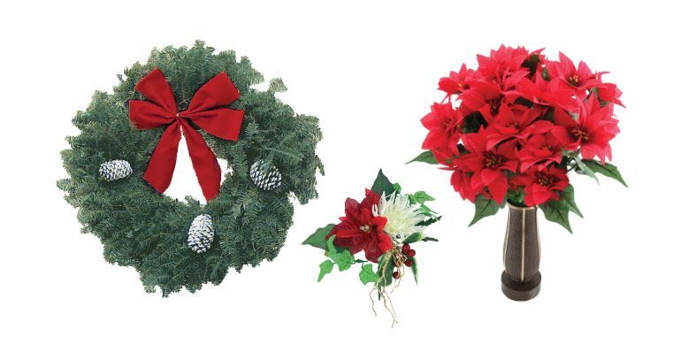 Christmas wreath and matching red poinsettia arrangement in a vase on white background