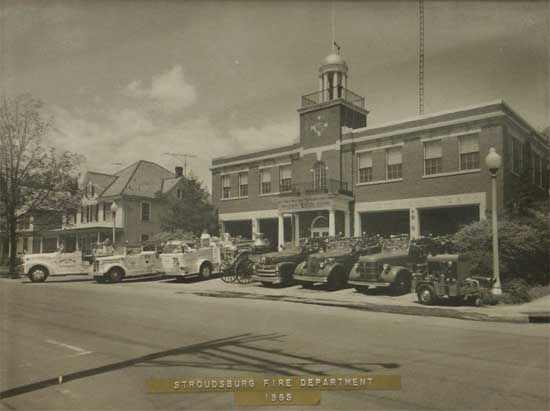 Old black and white photo of the Stroudsburg Fire Department, circa 1949, showing the fire station with fire trucks parked in front.