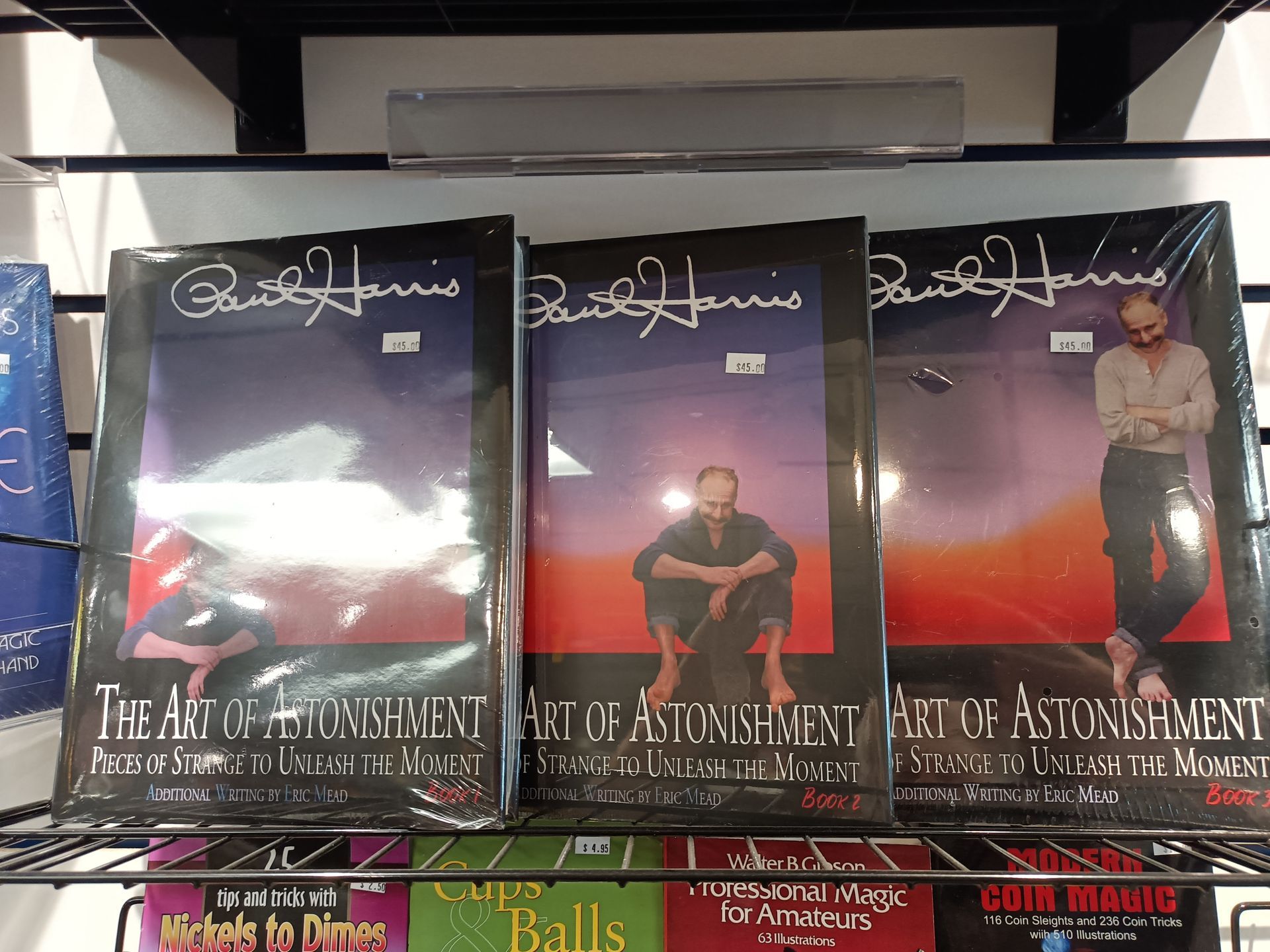 A shelf full of books including the art of alignment