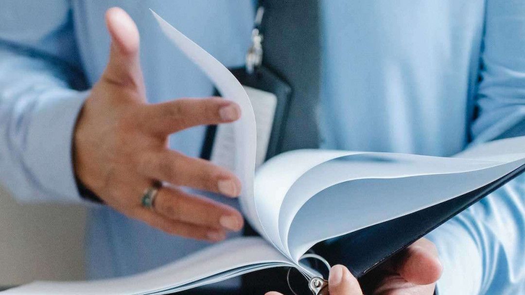Person Holding Papers