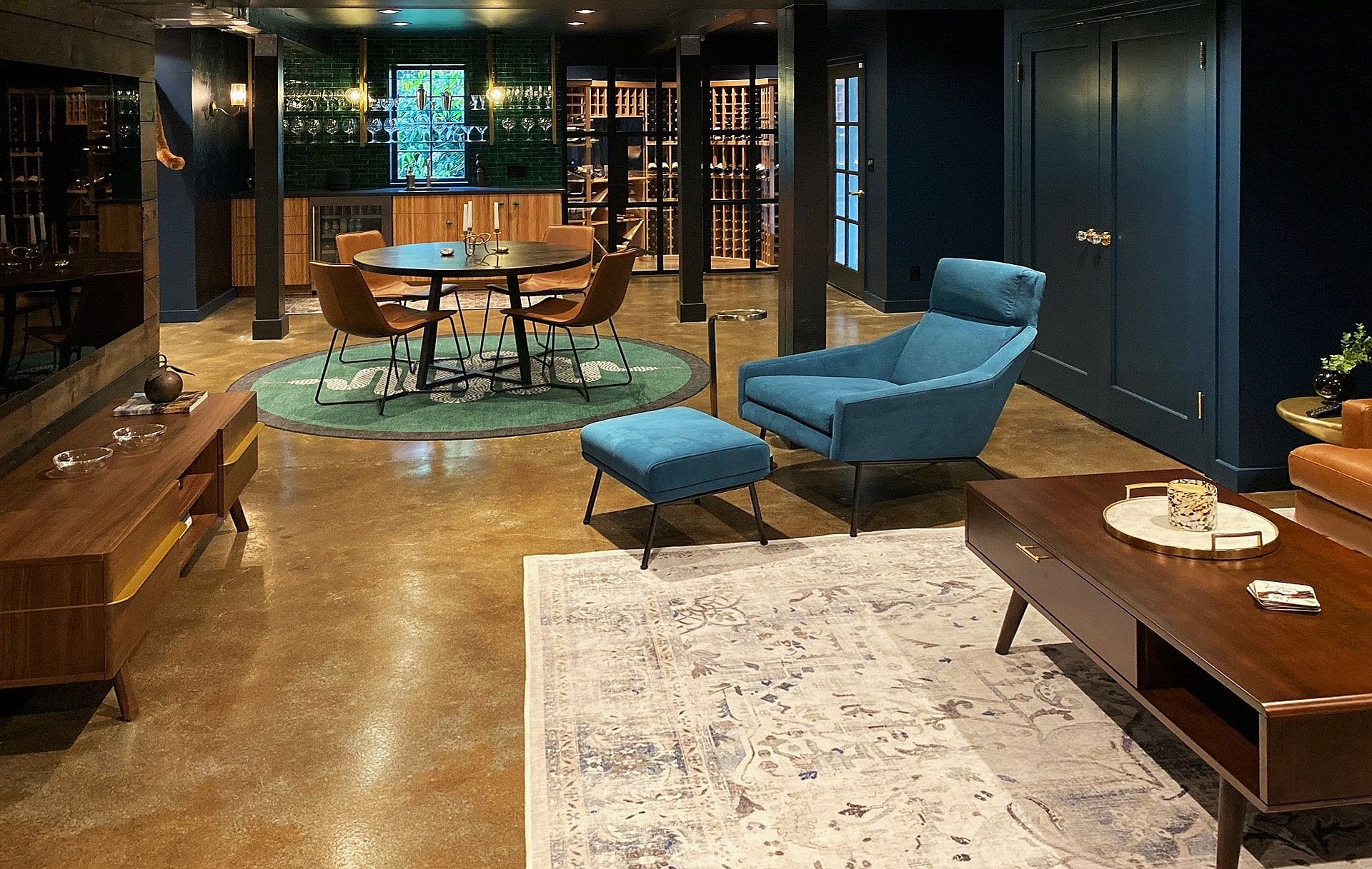A kitchen with white cabinets , stainless steel appliances , and a large island.