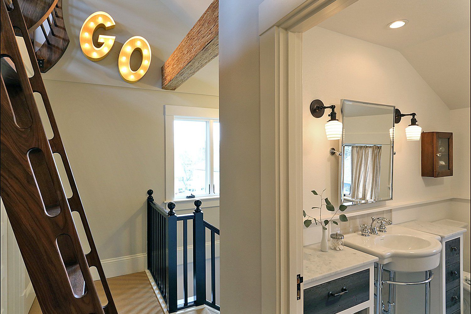 Off the 2nd floor landing is a bathroom and ladder to the new loft with a fun marquee sign on the wall, created by the homowner