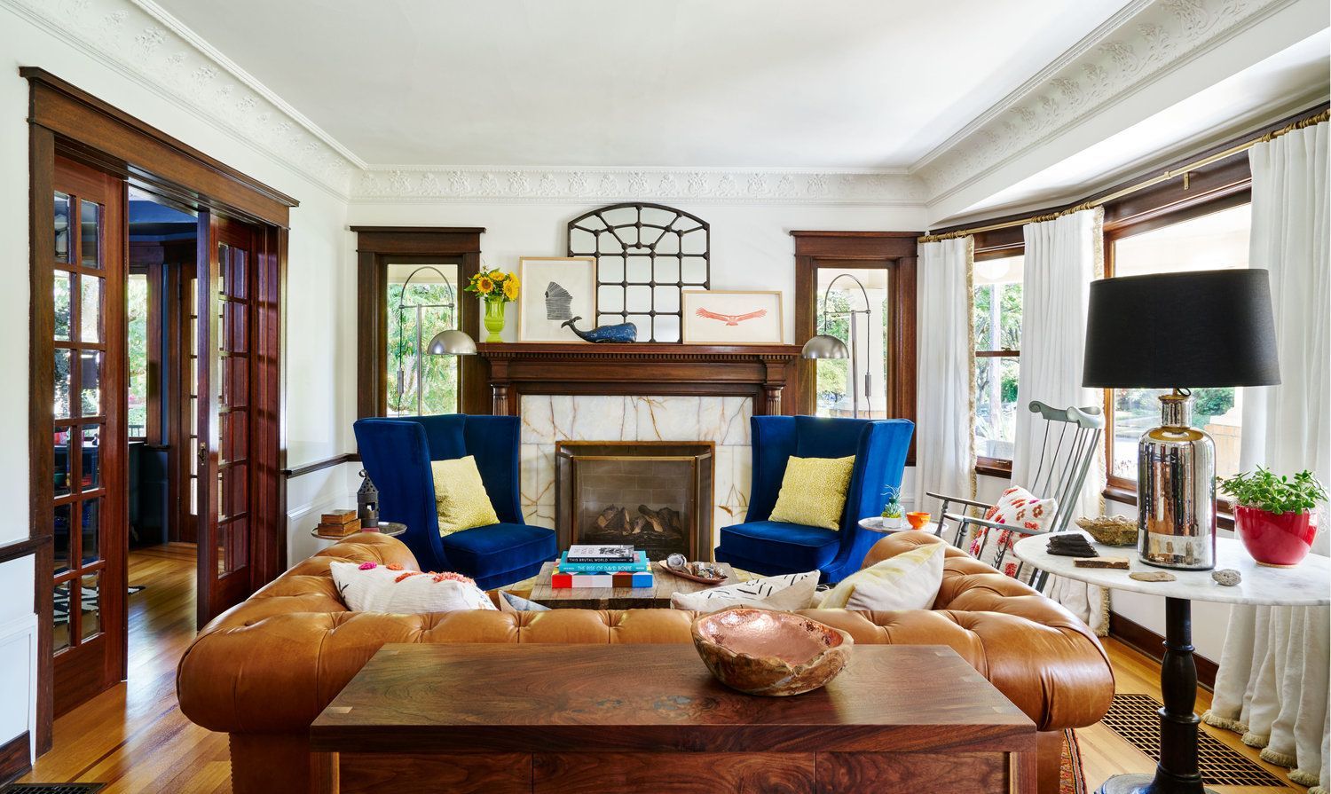 The living room is a light-filled, welcoming space just off the front porch.
